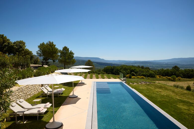 Swimming pool with lavender fields beyond