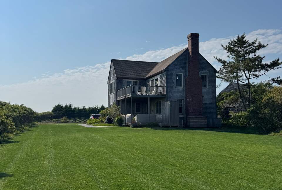 Large flat yard for lawn games w/ covered seating area downstairs