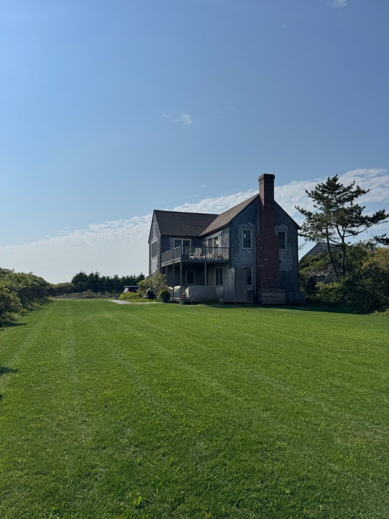 Large flat yard for lawn games w/ covered seating area downstairs