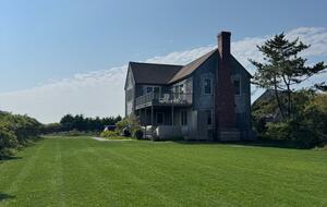 Large flat yard for lawn games w/ covered seating area downstairs