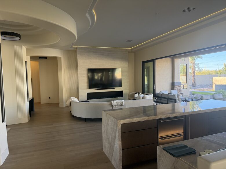 Multi slide panoramic doors completely open. Fireplace and 100 inch TV