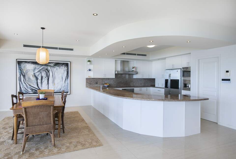 Full kitchen with induction cook top and microwave and pantry