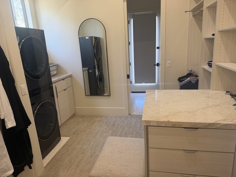 Master closet with additional laundry and access to Pool