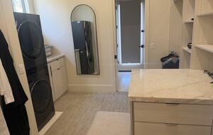 Master closet with additional laundry and access to Pool