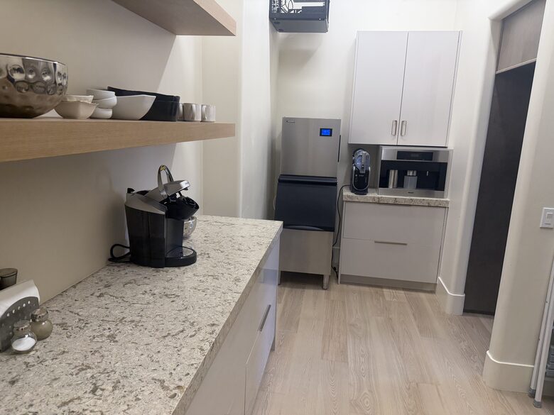 Hidden pantry with icemaker, Miele coffee maker and extra refrigerator