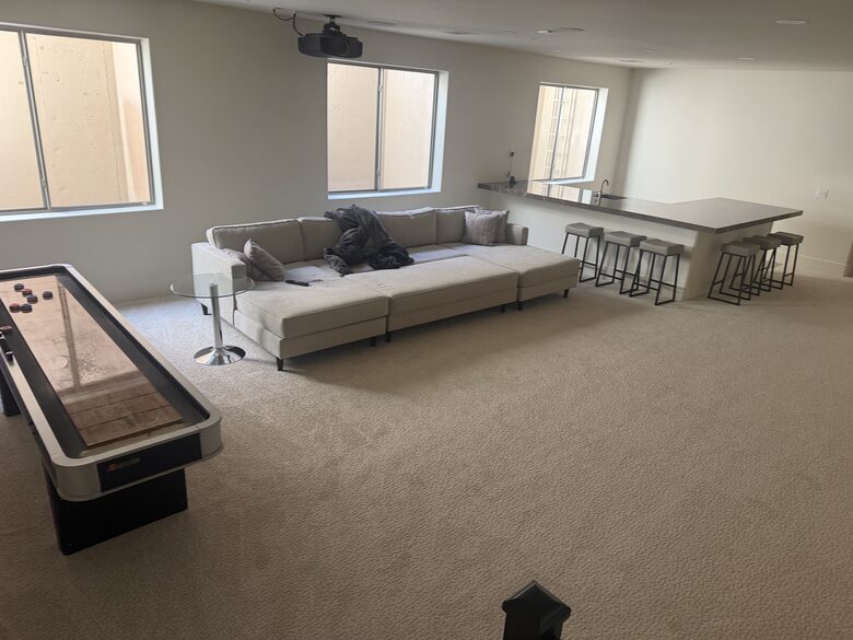 Full basement with bar, projector TV and shuffleboard