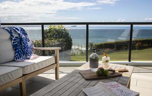 Relax on the deck with expansive ocean views