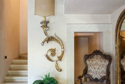 The staircase near the front door leading to the first floor