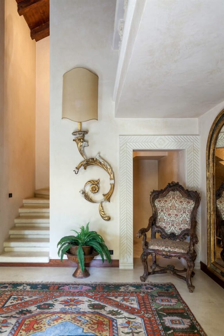 The staircase near the front door leading to the first floor