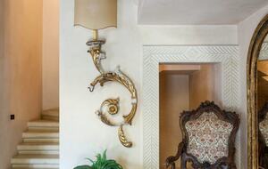 The staircase near the front door leading to the first floor