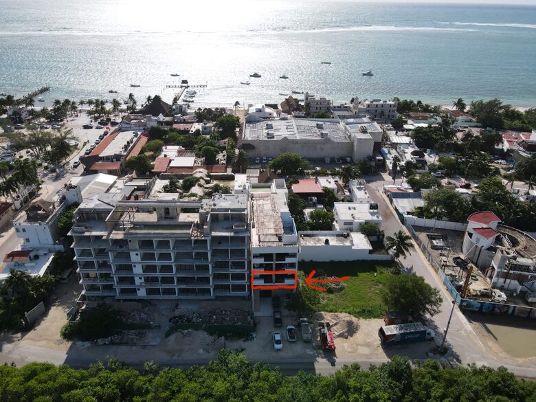 Drone view of the entire building & ocean proximity