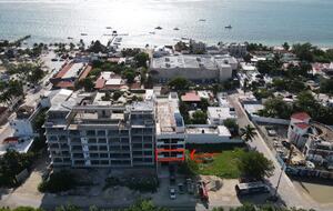 Drone view of the entire building & ocean proximity