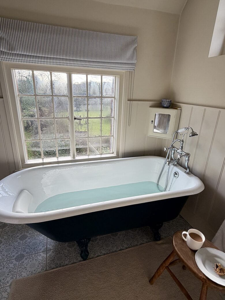 Enjoy a bath with a stunning rural view in upstairs bathroom.