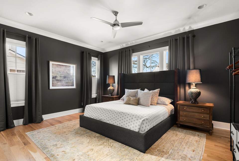 Primary suite with black out curtains and soundproofing features