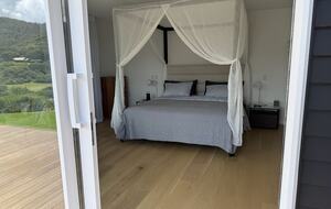 North-Facing Coastal Estate Overlooking Piha Beach - Piha, New Zealand