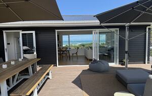 North-Facing Coastal Estate Overlooking Piha Beach - Piha, New Zealand