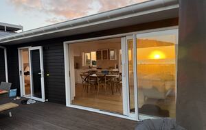 North-Facing Coastal Estate Overlooking Piha Beach - Piha, New Zealand