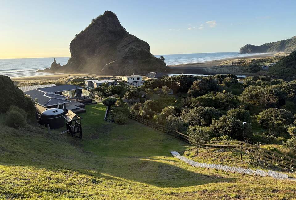 View of Lion Rock over house from crest of dune on property