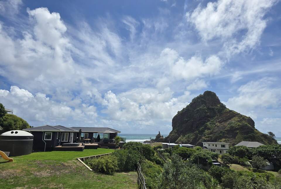 North-Facing Coastal Estate Overlooking Piha Beach - Piha, New Zealand