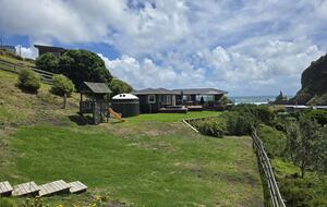 North-Facing Coastal Estate Overlooking Piha Beach - Piha, New Zealand