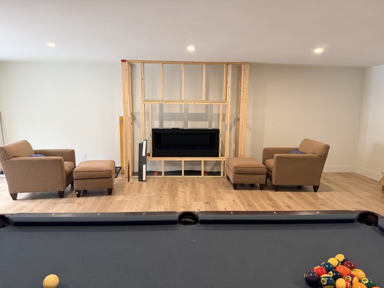 Soon-to-be-finished fireplace in game room
