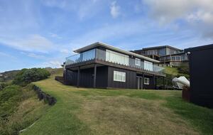 North-Facing Coastal Estate Overlooking Piha Beach - Piha, New Zealand