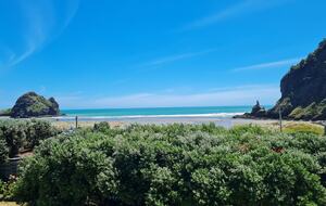 North-Facing Coastal Estate Overlooking Piha Beach - Piha, New Zealand
