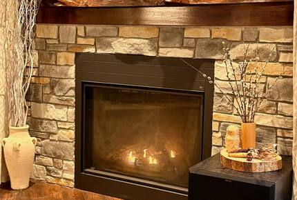 When the Muskoka autumn air turns crisp, the living room fireplace bec