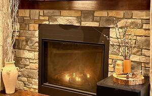 When the Muskoka autumn air turns crisp, the living room fireplace bec