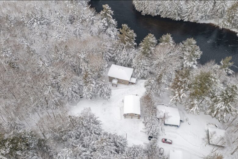 Private Riverfront Sanctuary within a Snowy Forest Canvas