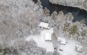 Private Riverfront Sanctuary within a Snowy Forest Canvas