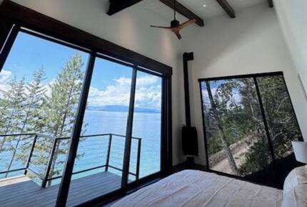 Primary bedroom with balcony