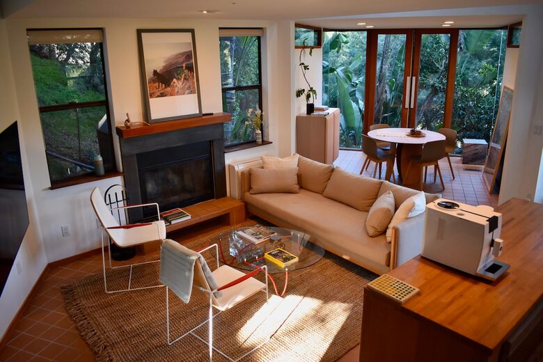 Living Room features wood-burning fireplace, comfy seating,