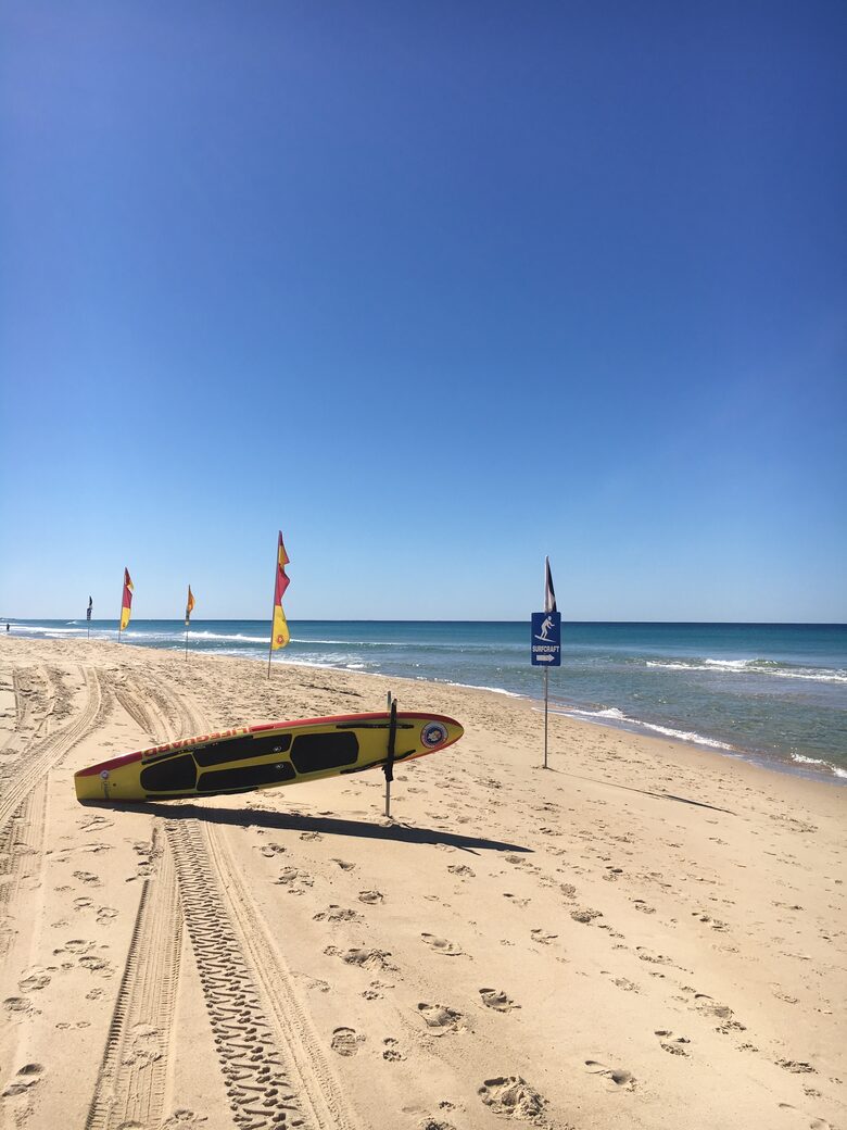 Lifesavers patrol beach in front of house on school holidays