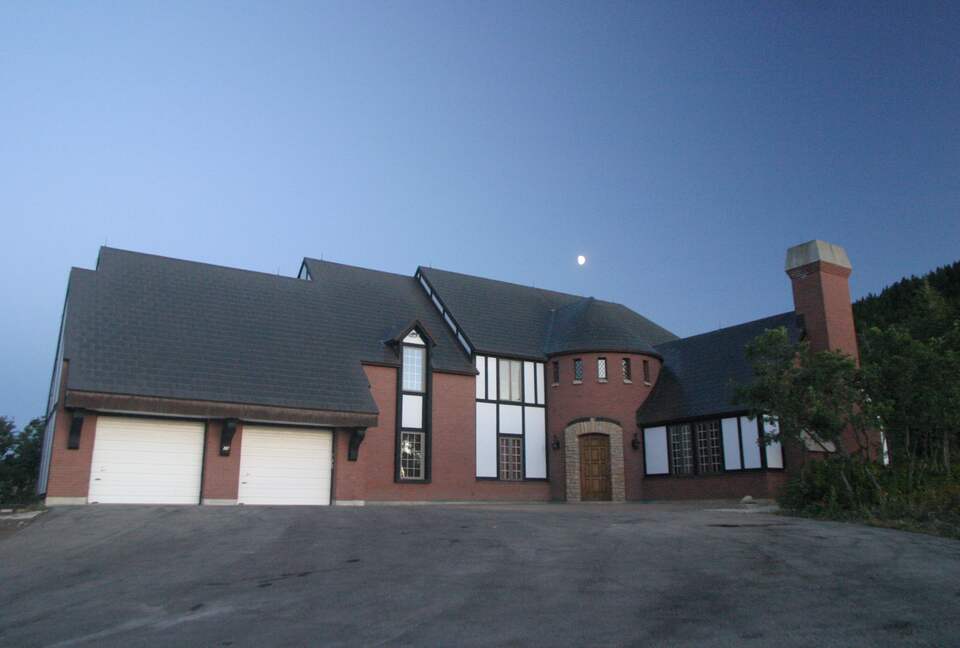 Front view of house with moon above