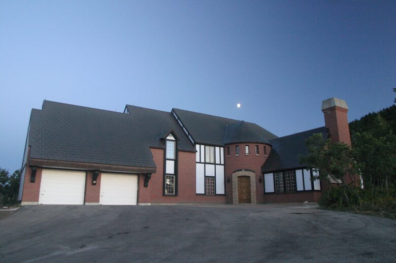 Front view of house with moon above