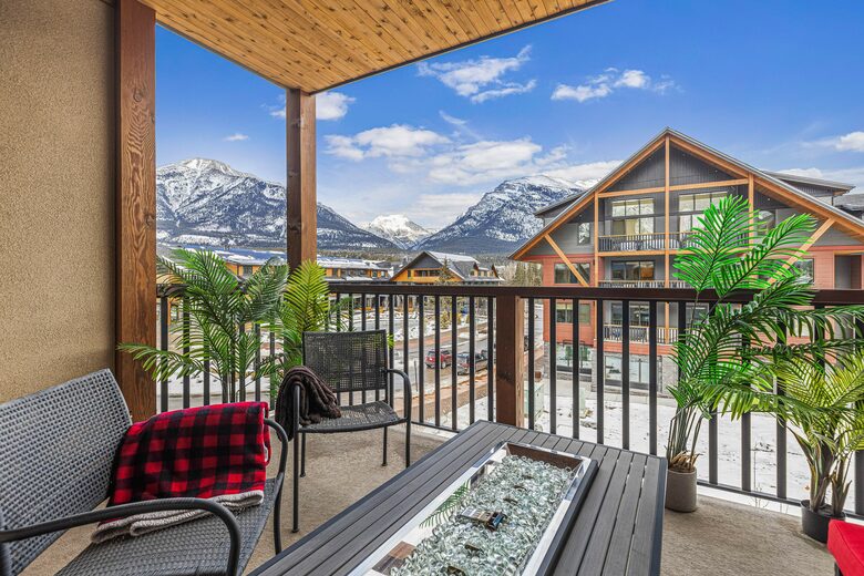 Balcony with mountain views and gas fire pit.