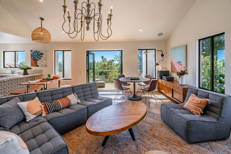 Airy living room with a connected balcony and views of the o