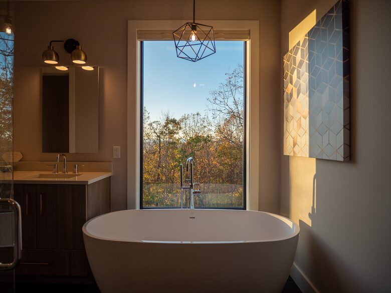Master soaking tub, dual shower with private wooded views
