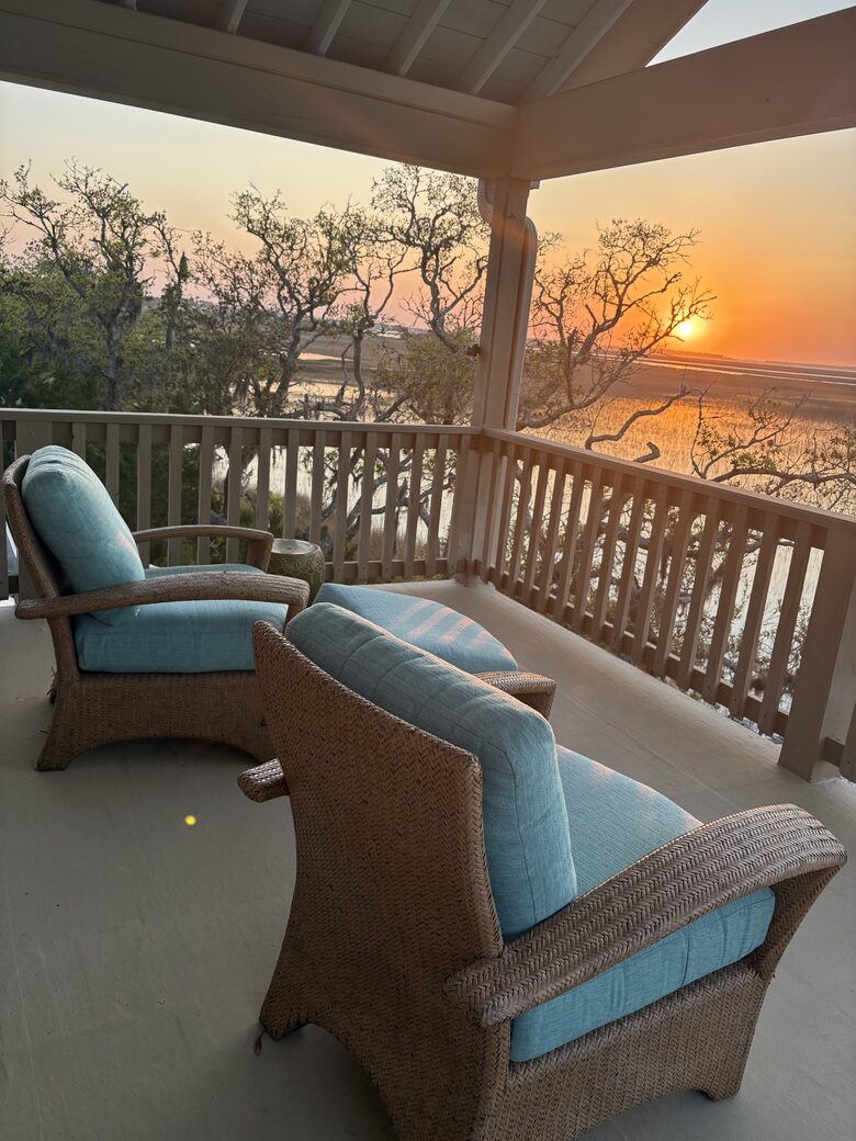 Master level outdoor sitting area with marsh views