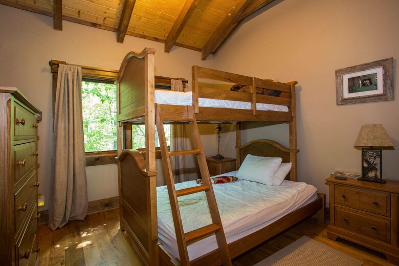 Upstairs bedroom with bunk beds that sleep 3