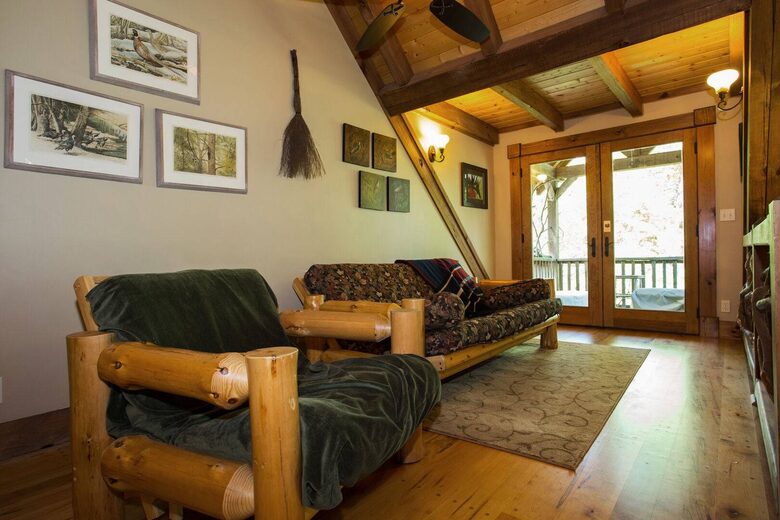 Seating area upstairs leading to porch. Queen size futon.