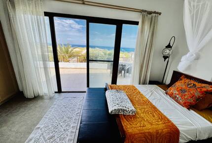 master bedroom with balcony and view