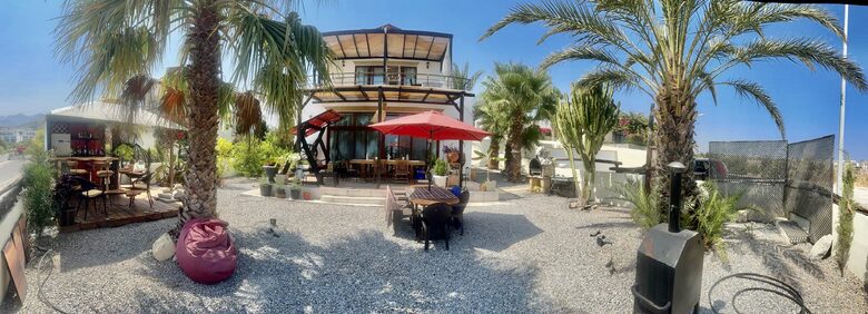 front of villa, top balcony and porch with dining ts,hammock+BBQ