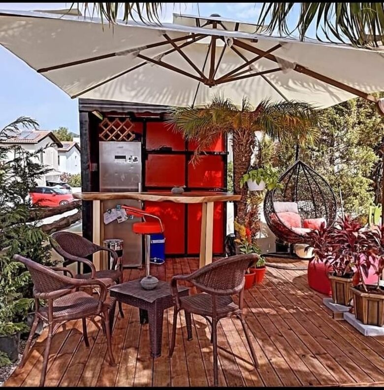 garden bar with full size fridge and egg chair