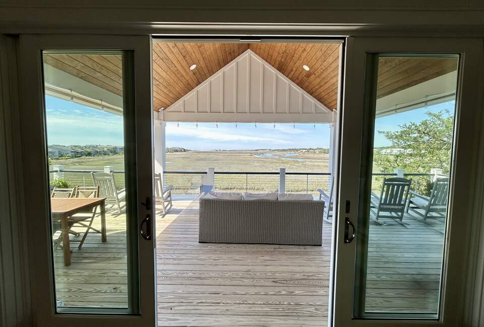 Den with Covered Deck & Waterfront Creek View