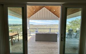 Den with Covered Deck & Waterfront Creek View
