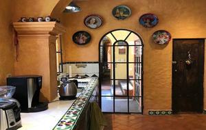 Folk art and tile in kitchen