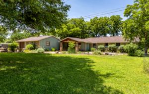 Shaded front yard with plenty of parking