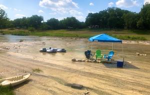 The water is more shallow right in front of the house